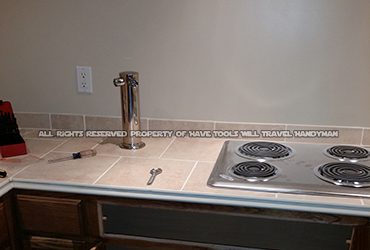 set-up and installed new cabinets, tile, cook-top and beer tap